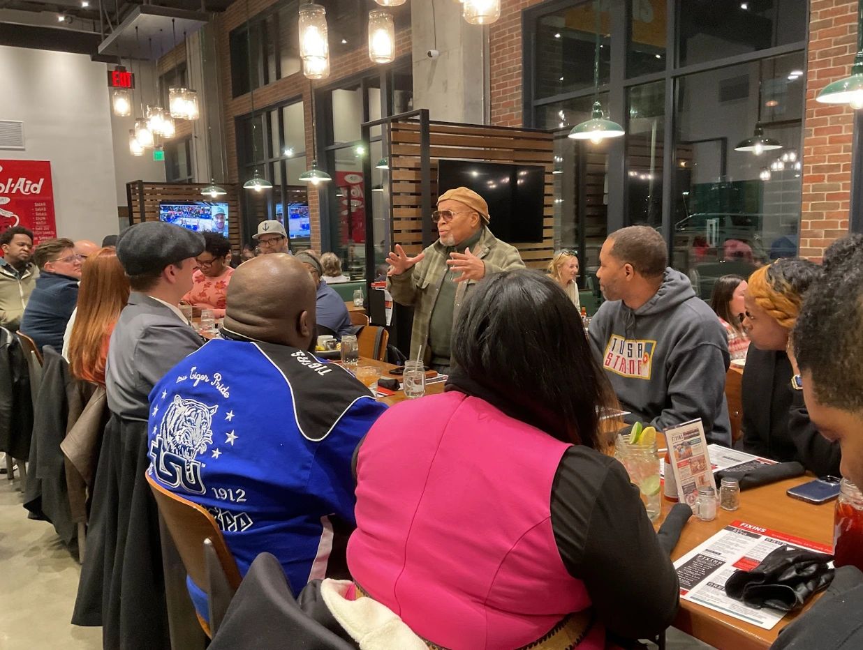 People gathered in a restaurant talking