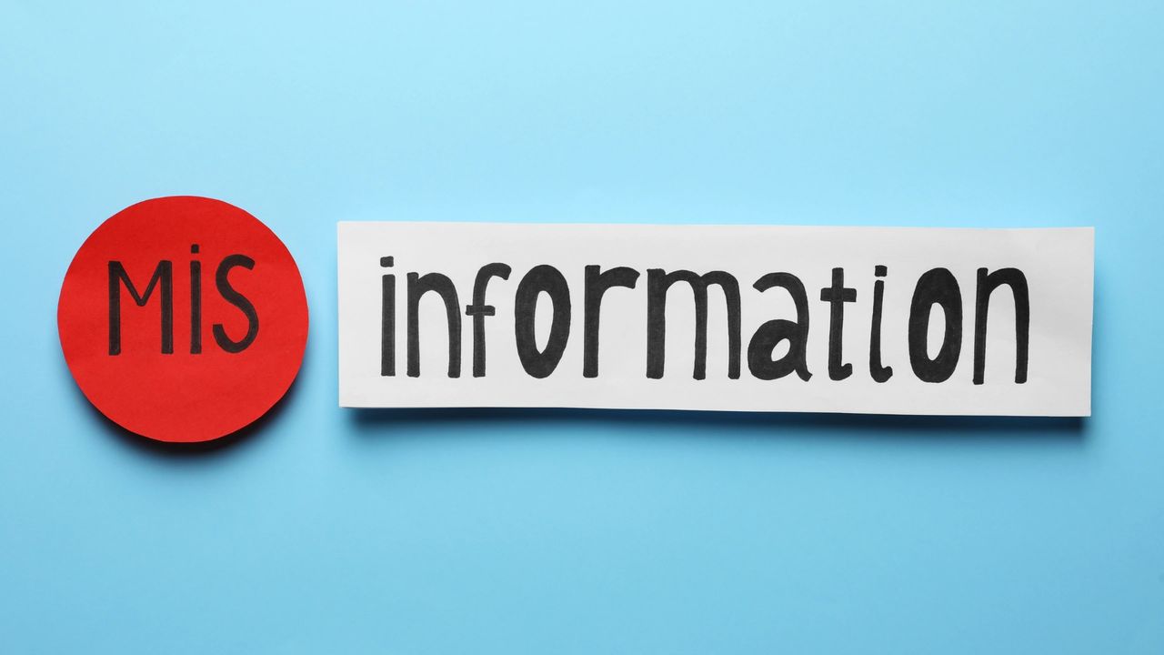Sign on blue background that says Mis Information