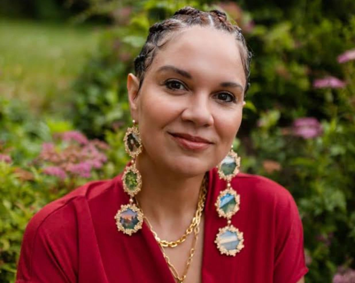 Portrait of a black woman with strong, content expression.