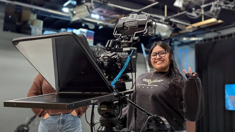 Native woman smiling in video production studio