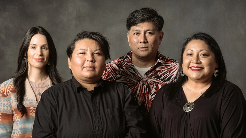 Portrait of four adults of Native American descent.