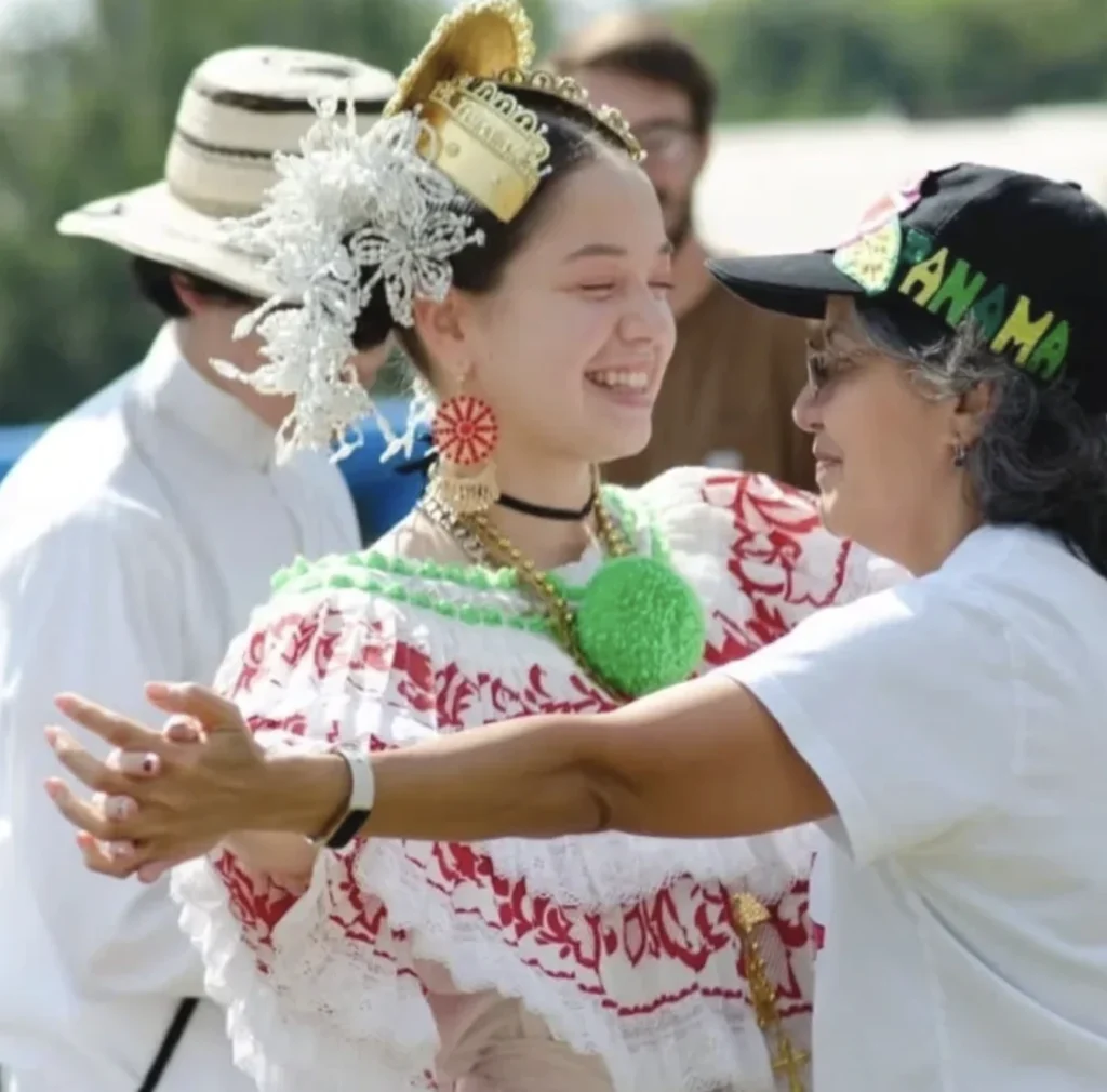 two people dance together at a festival