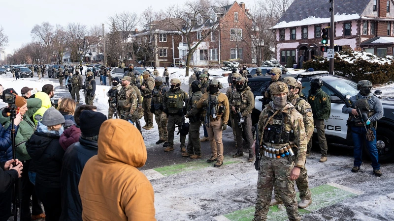 Federal immigration agents and bystanders in South Minneapolis following the fatal shooting of Renee Nicole Good on Jan. 7, 2026. (Photo: Chad Davis / chaddavis.photography, CC BY 4.0)