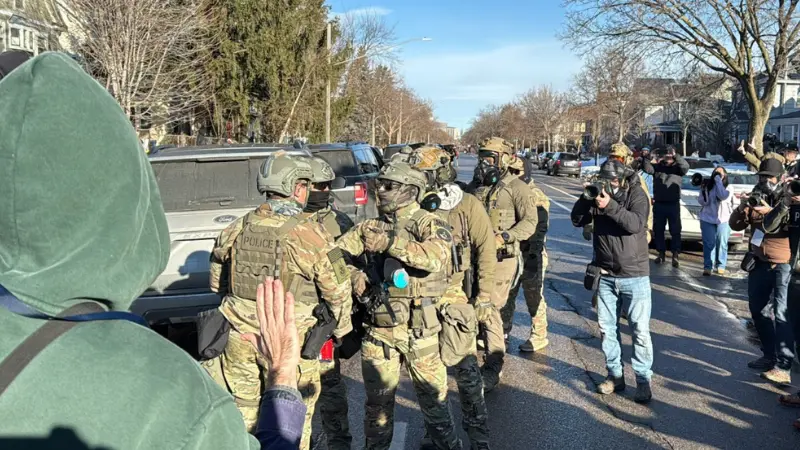 Residents, journalists, and protesters document ICE action on Park Avenue in Minneapolis. (Eric Ortiz)