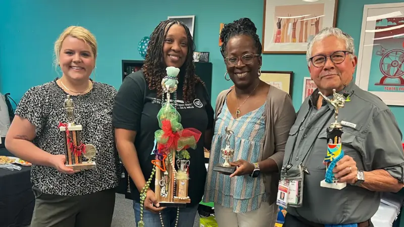 The MFP team. Pictured from left are State Reporter Heather Harrison, Systemic and Education Editor Torsheta Jackson, Publisher and Director of Revenue Tami Jones and Senior Photojournalist Rogelio V. Solis. The outlet recently discovered it had unknowingly published an AI-generated opinion column under a fake author. MFP Photo